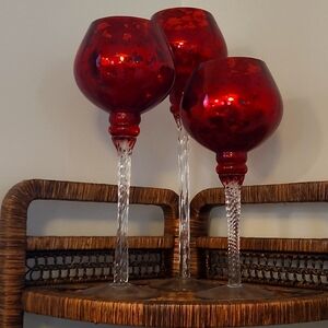 3 red candle holders